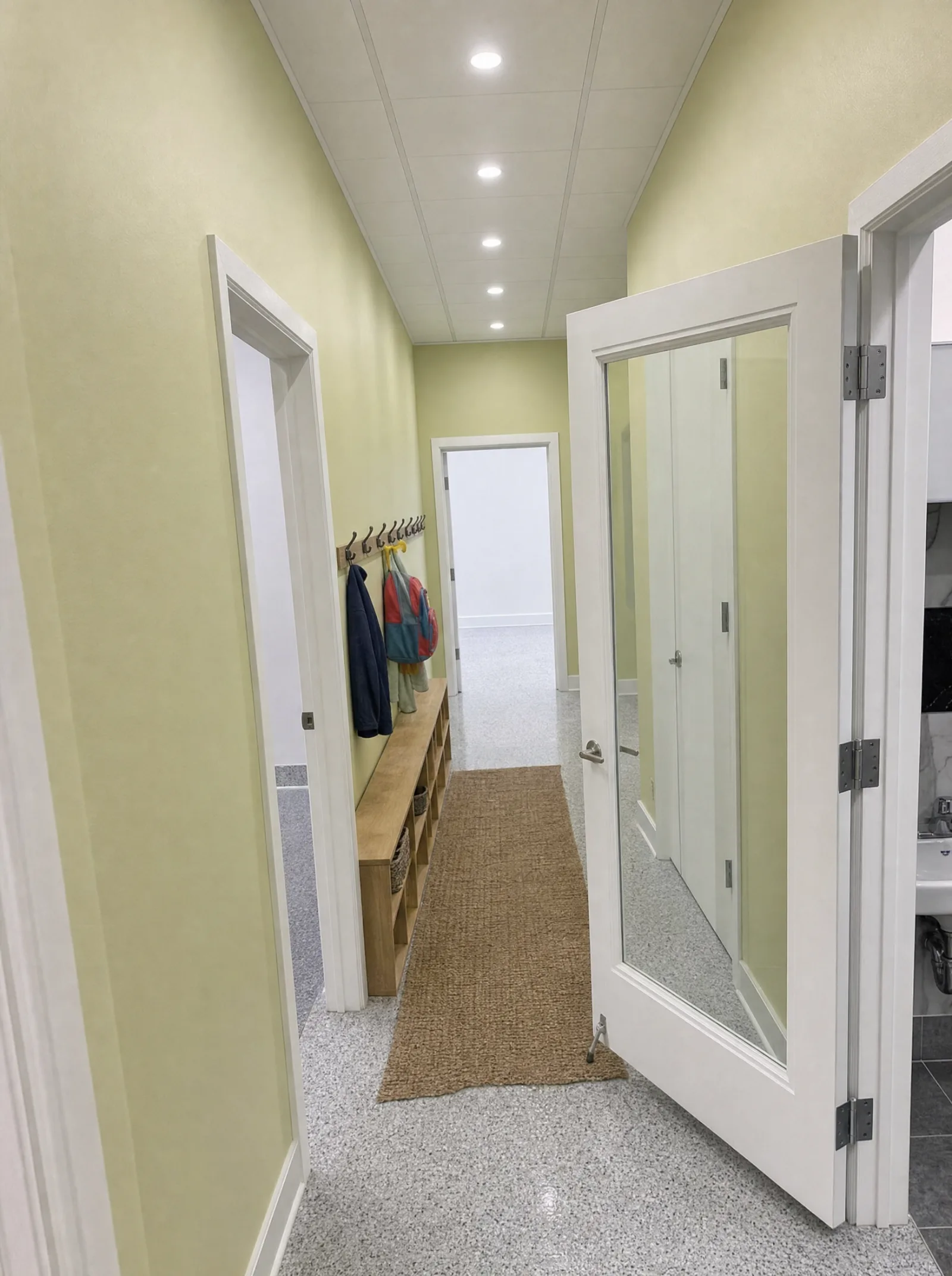 Corridor with cubbies and coat hooks for each child.